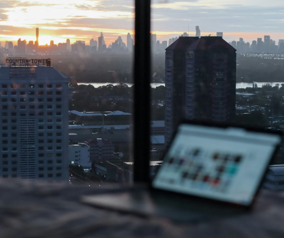 Remote financial professional at laptop representing a future-proof location-independent career in financial services and insurance