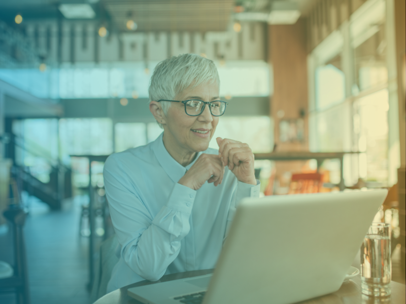 A 40+ professional working remotely abroad, representing seasonal and nomad career paths for career changers