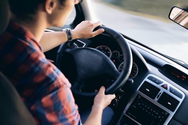 International driving permit document with car keys representing what an IDP is and how to obtain one for driving abroad