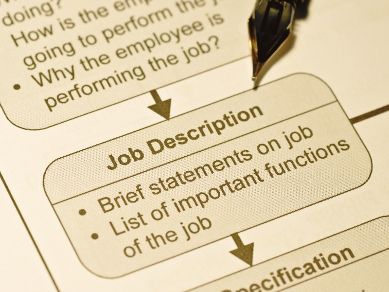 Remote worker reviewing a job listing on laptop representing how to read remote job descriptions like a professional recruiter