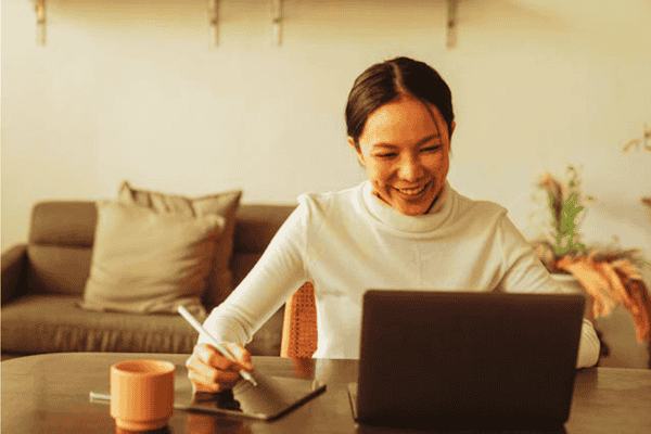 Distributed remote team working from home on devices representing research showing remote-first workplaces outperform traditional offices