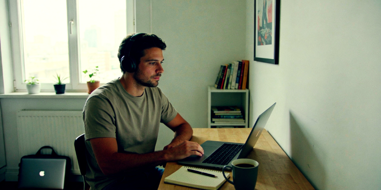 Remote worker using laptop in a modern home office representing what remote work will look like in 2026