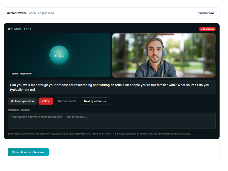 A live interview simulation showing a technical question, a video preview, and an editable transcript